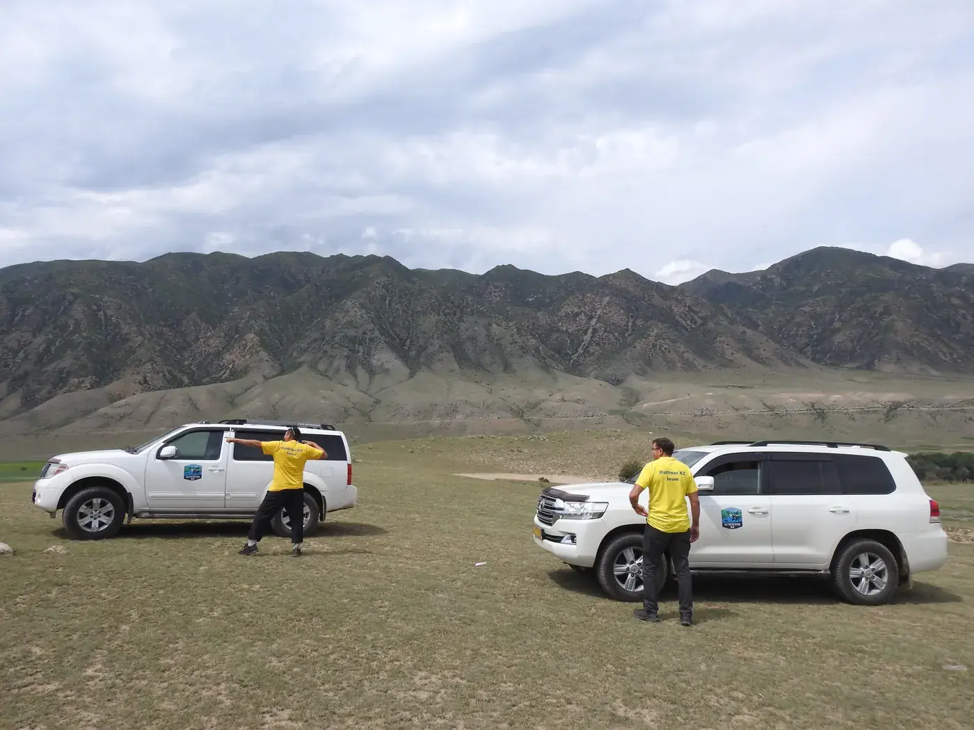 Our guides with two Land Cruisers on the open steppe