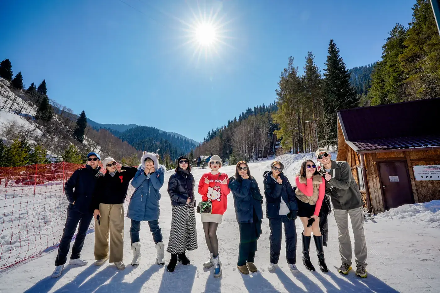 A group of our travelers in the snow in the mountains