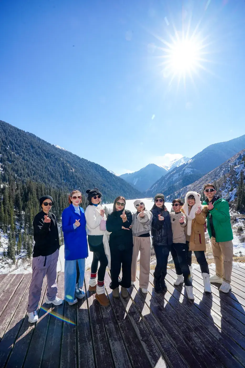 A group of travelers on a mountain viewing deck